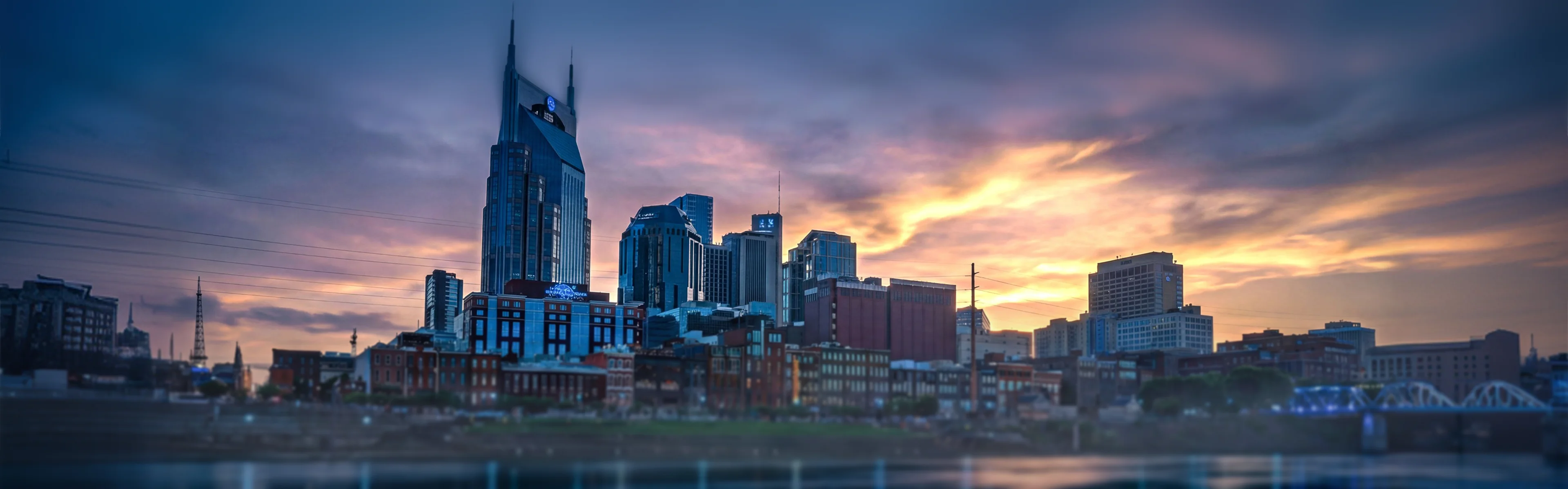 Nashville skyline with downtown towers and riverfront - managed Wi-Fi, fiber internet, and bulk TV services for Nashville multifamily properties