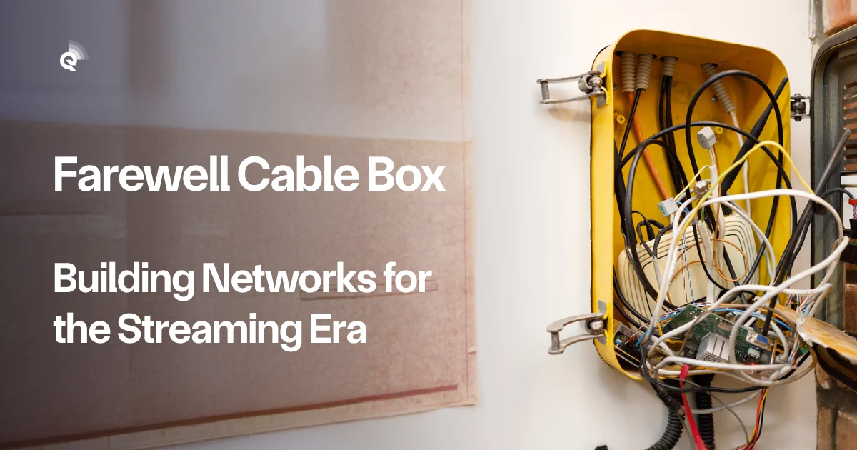 Open wall-mounted utility box crammed with tangled cables and exposed circuit boards