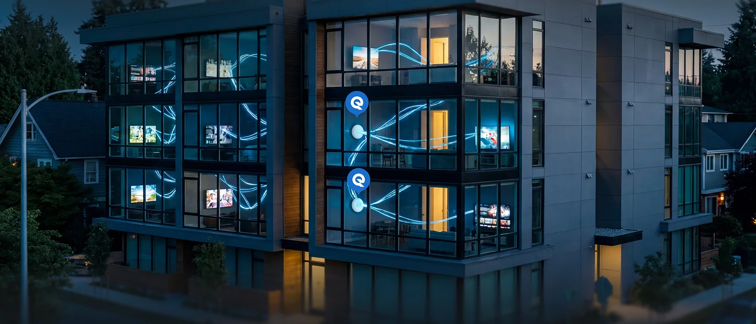 Modern apartment building at dusk with glowing blue network lines connecting access points to lit units showing TVs